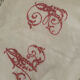 Antique white cotton pillowcase with crochet and monogram.