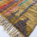 Moroccan Berber carpet Boujaad ochre with colorful patterns 253x142cm