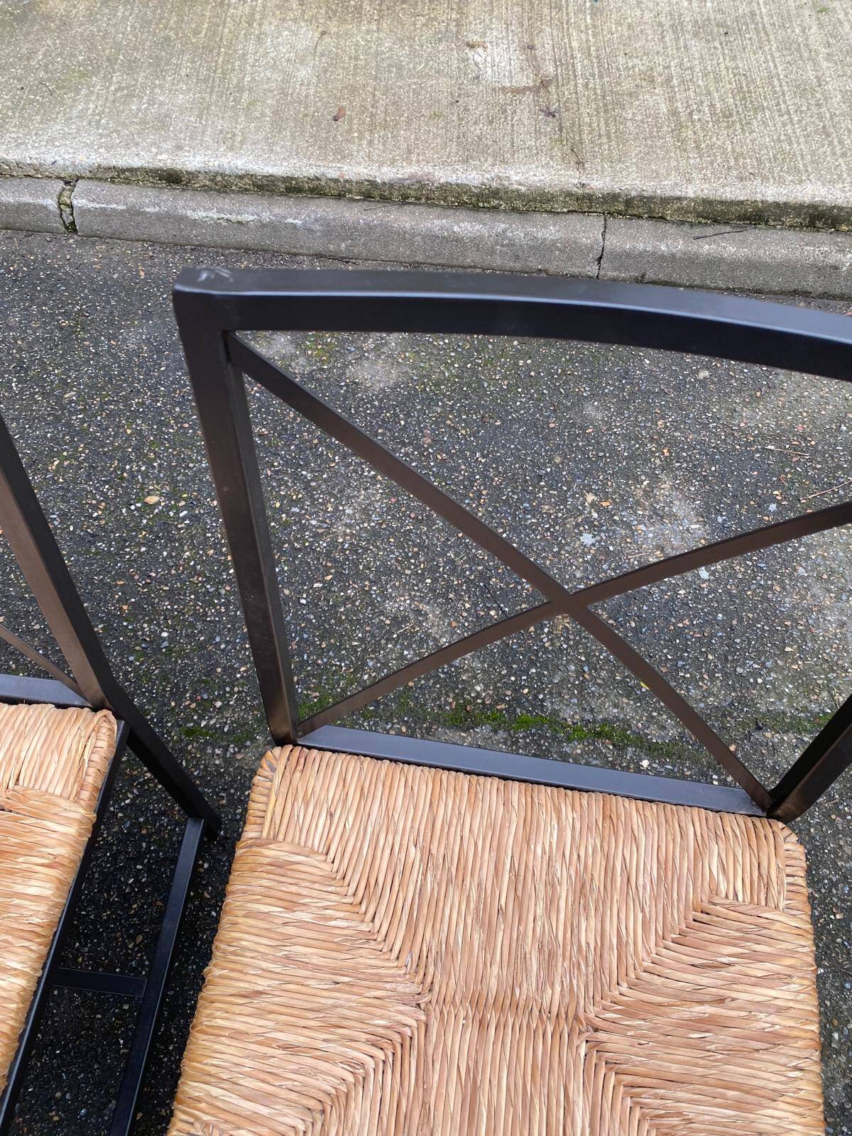 2 Scandinavian chairs with black steel and straw from IKEA Granas.