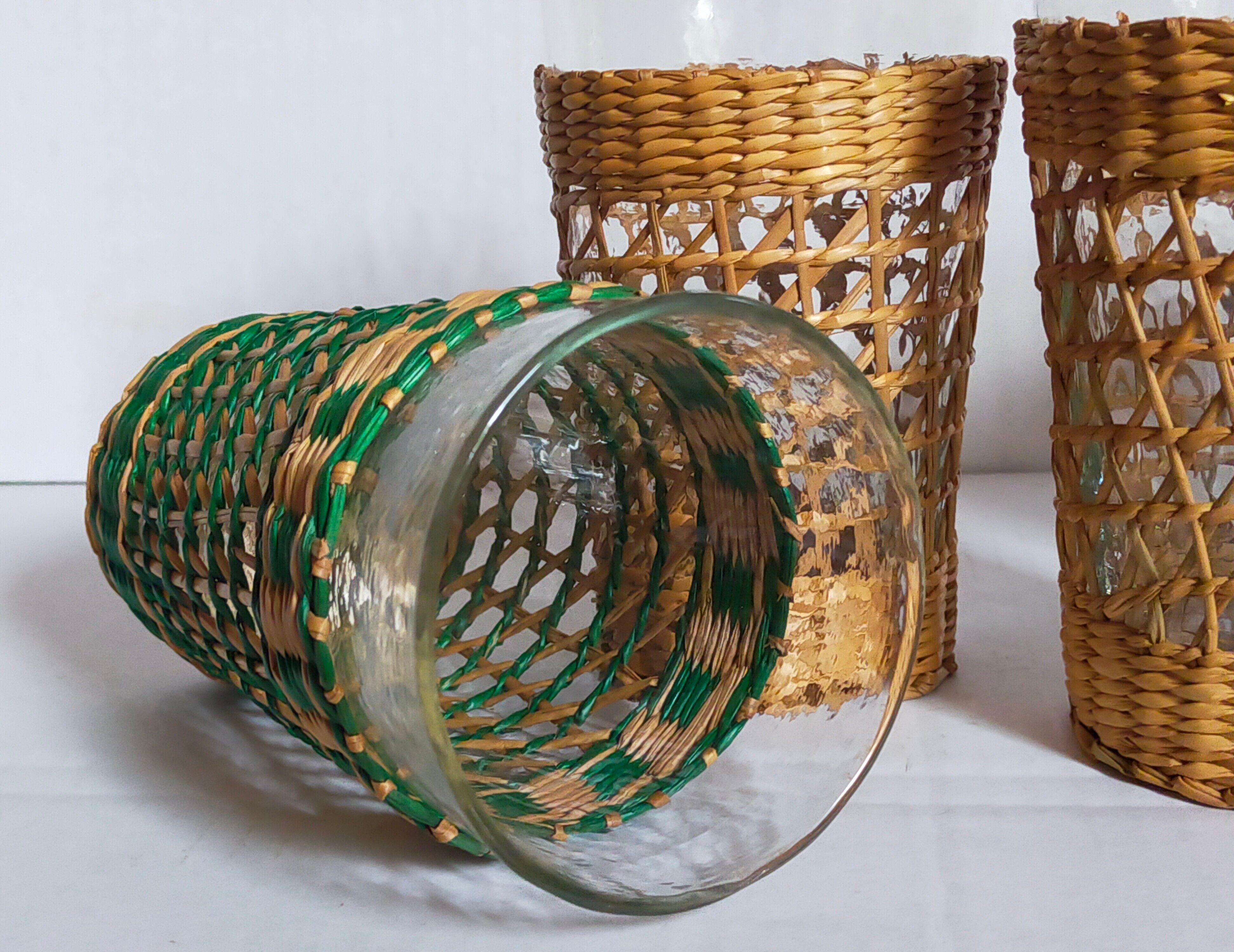 Four long drink glasses in vintage woven rattan cases
