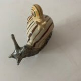 Porcelain figurine snail and its small