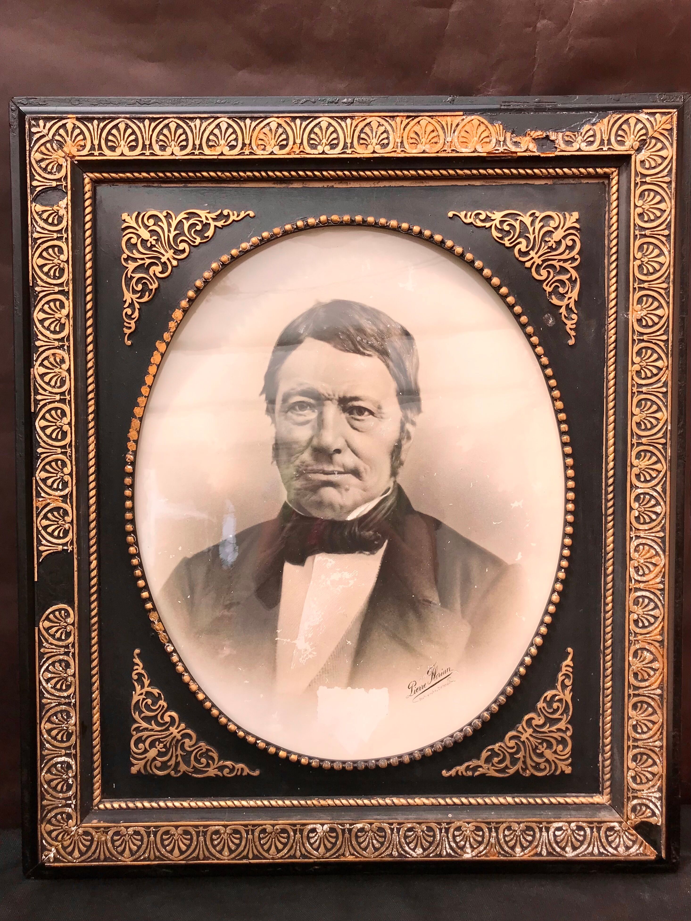 Black and gilded ebonite frame, wood and plaster 19th century