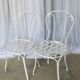 Pair of antique garden chairs, wrought iron, white paint.