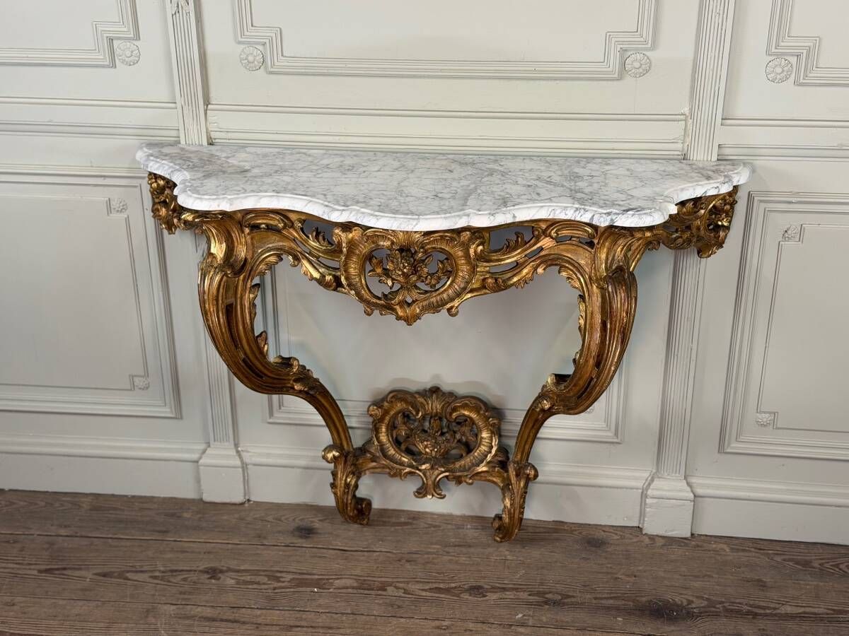 Louis XV style console in carved and gilded wood, circa 1880.