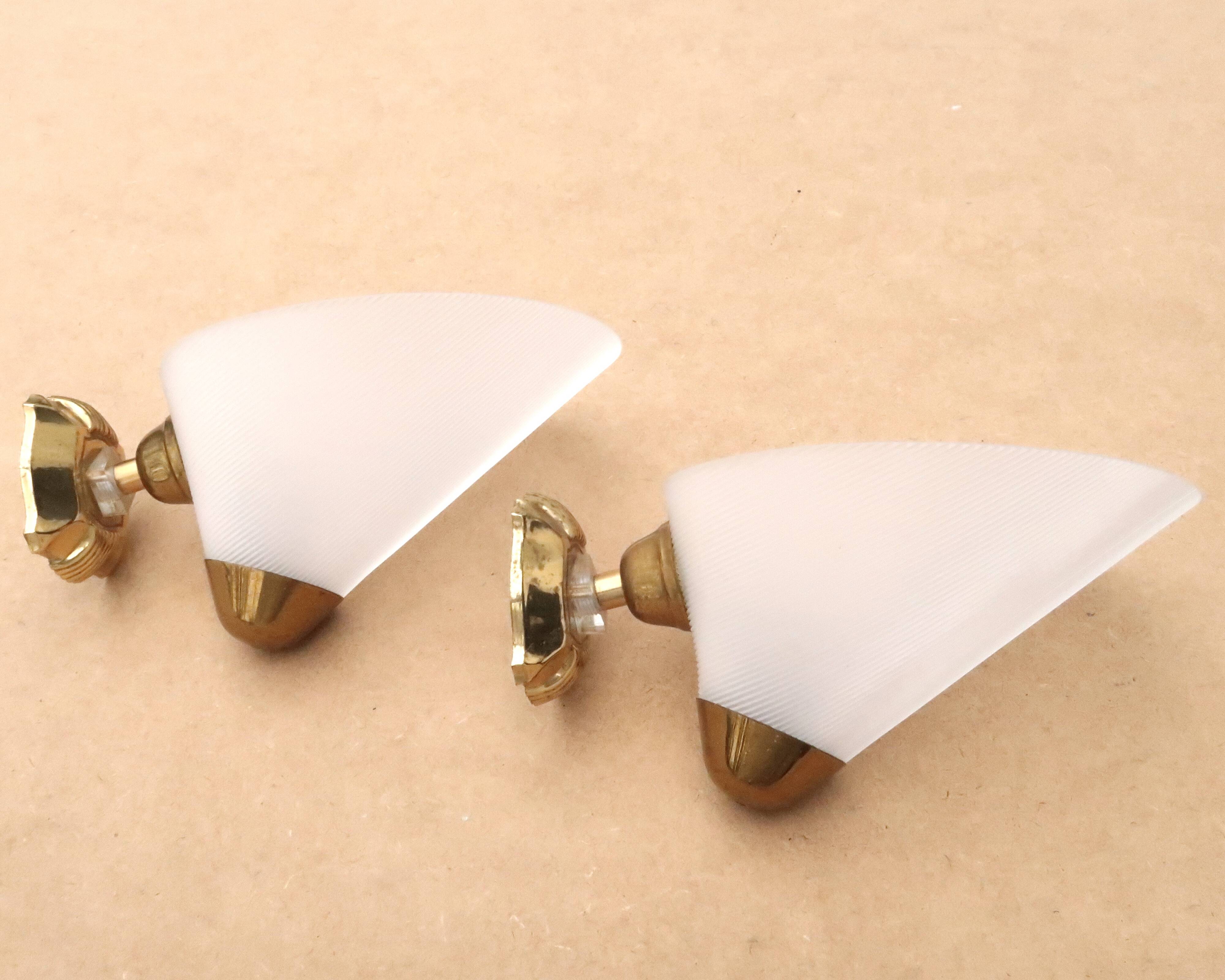 Pair of white and gold wall lights, 1950s