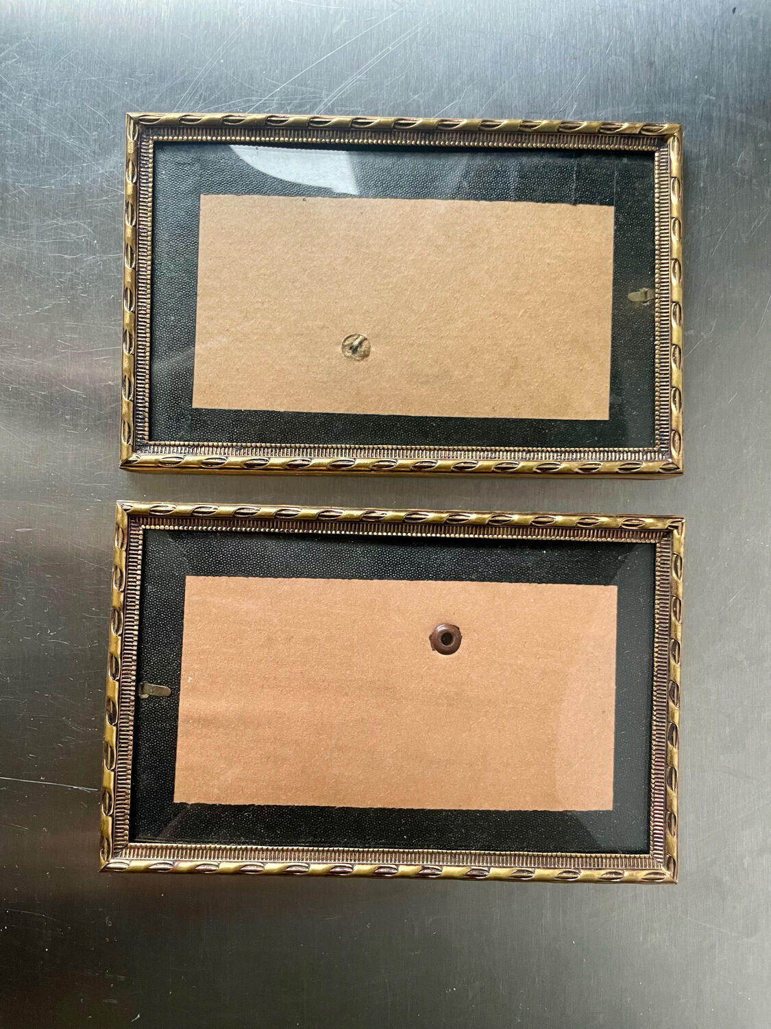 Pair of identical gold colored metal frames each measures  14.5 cm x 9 cm convex glass