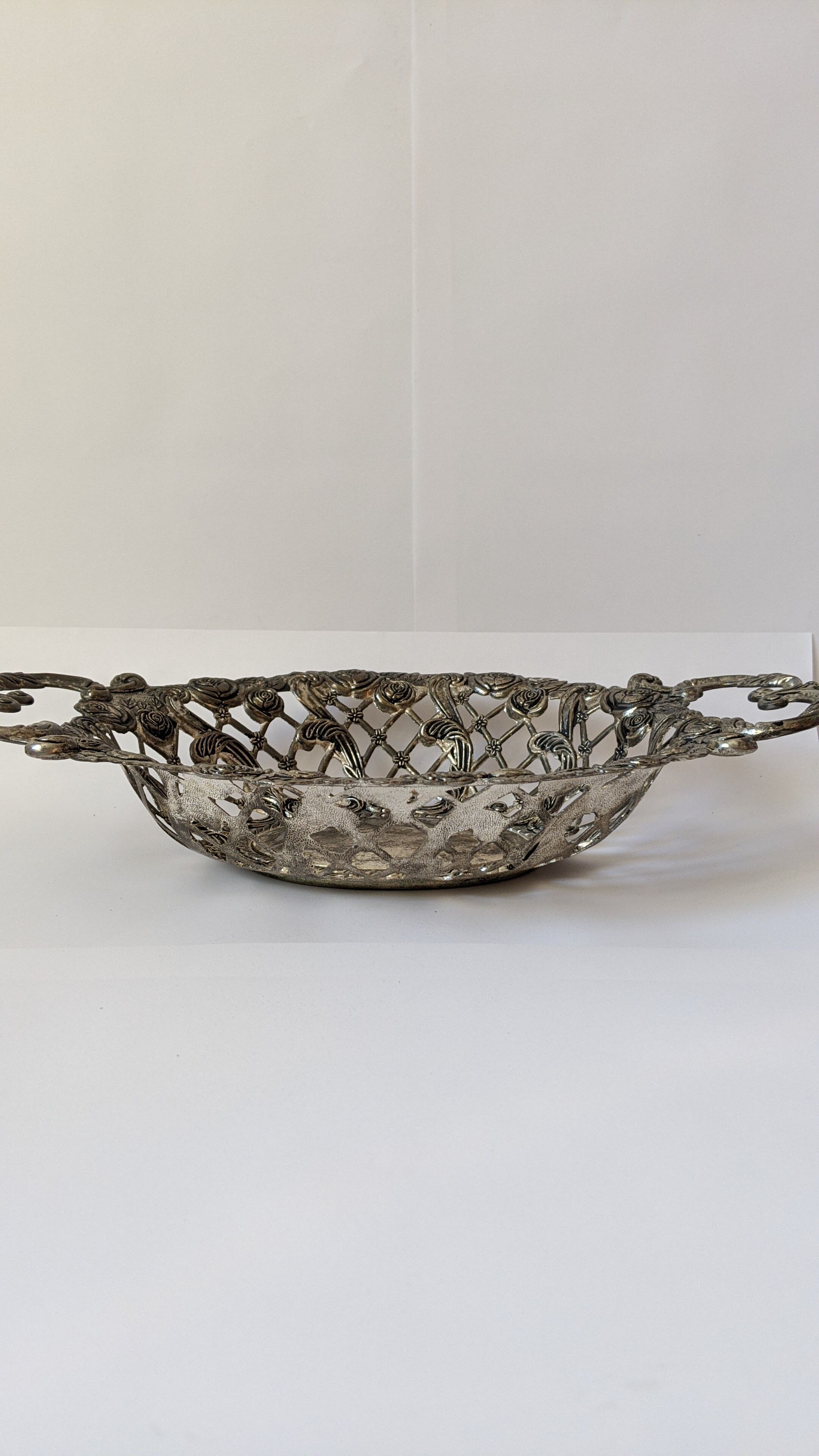 Beautiful silver metal basket with rose decoration