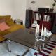 Table basse verre fumé pieds chromés