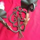 Pair of green wrought iron appliques with golden acanthus leaves