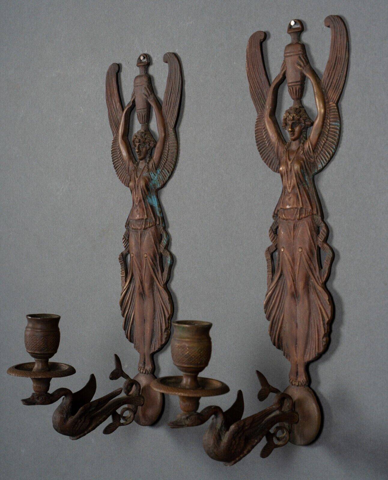Pair of Empire period bronze sconces decorated with a winged woman