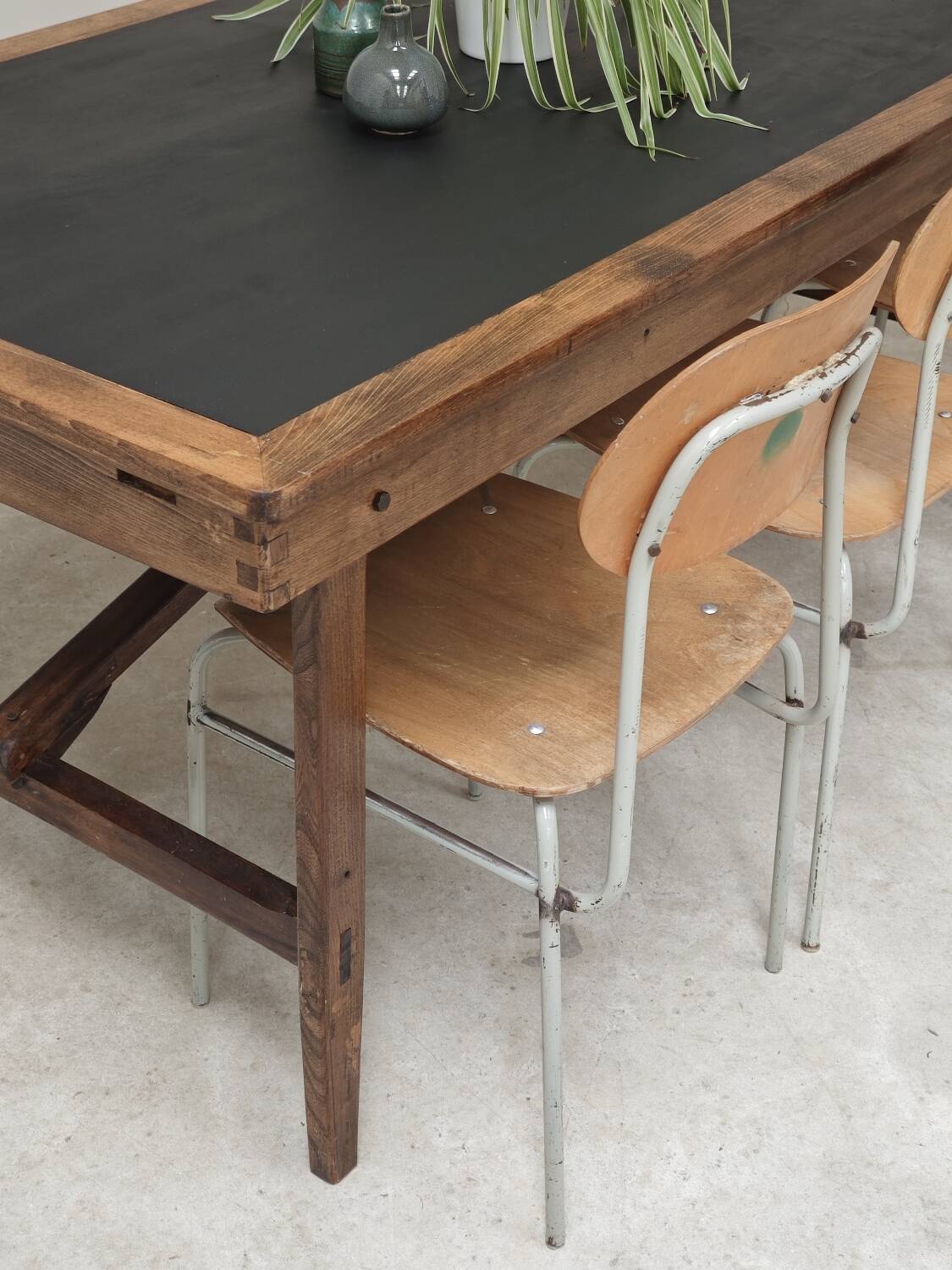 Vintage workshop folding table in oak with a hand-patinated black top.