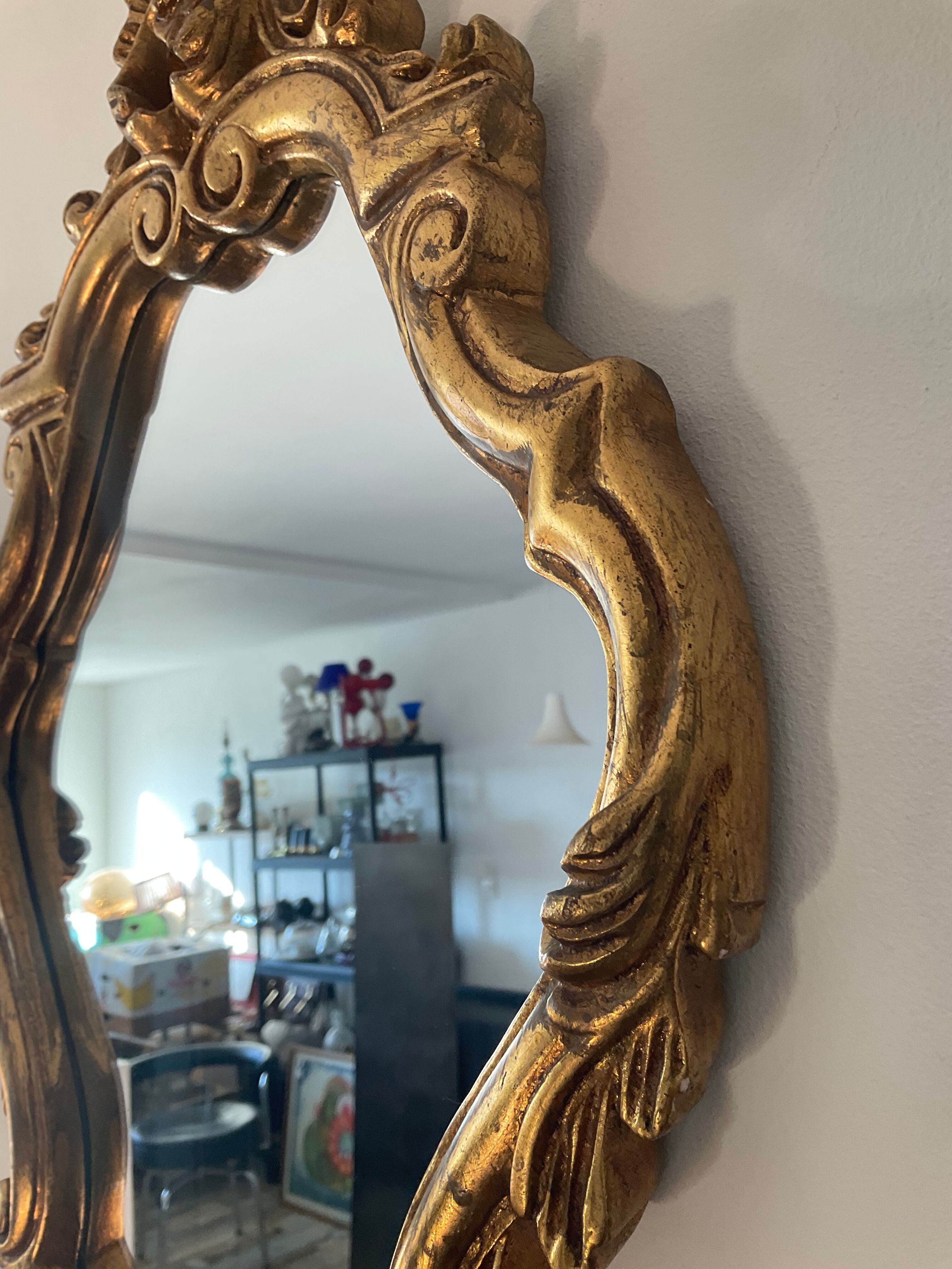 Old italian mirror in gilded plaster with leaf
