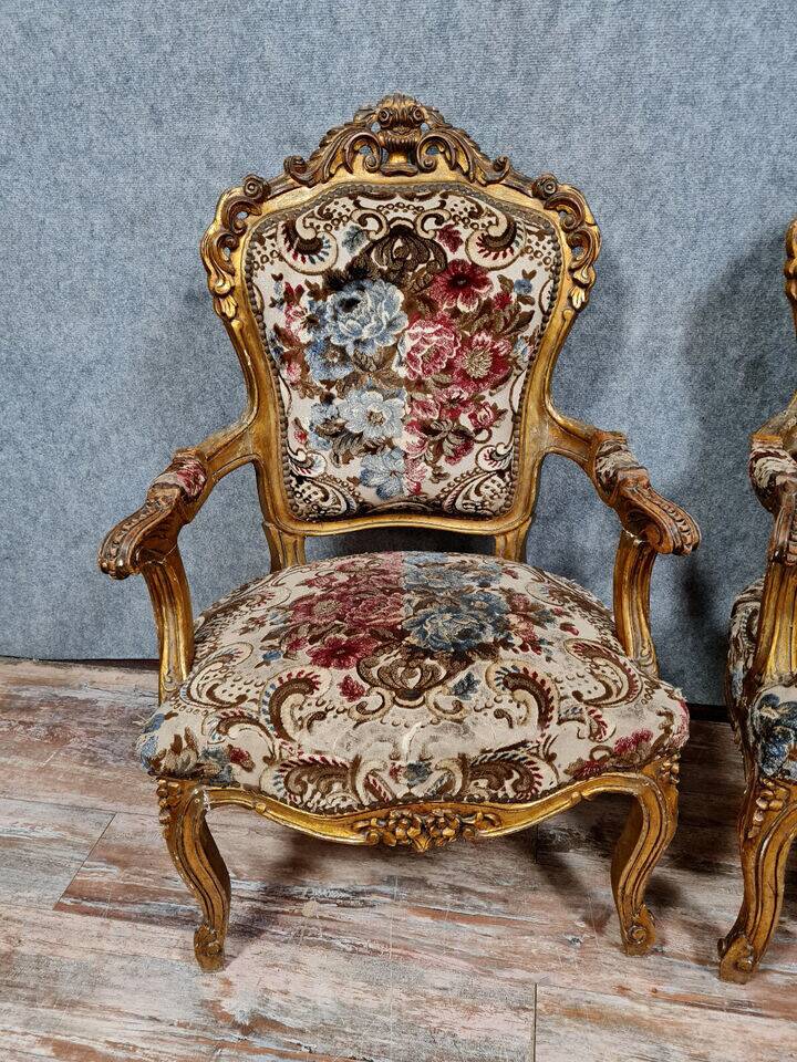Pair of Louis XV style Baroque armchairs in gilded and carved wood circa 1900