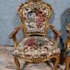 Pair of Louis XV style Baroque armchairs in gilded and carved wood circa 1900