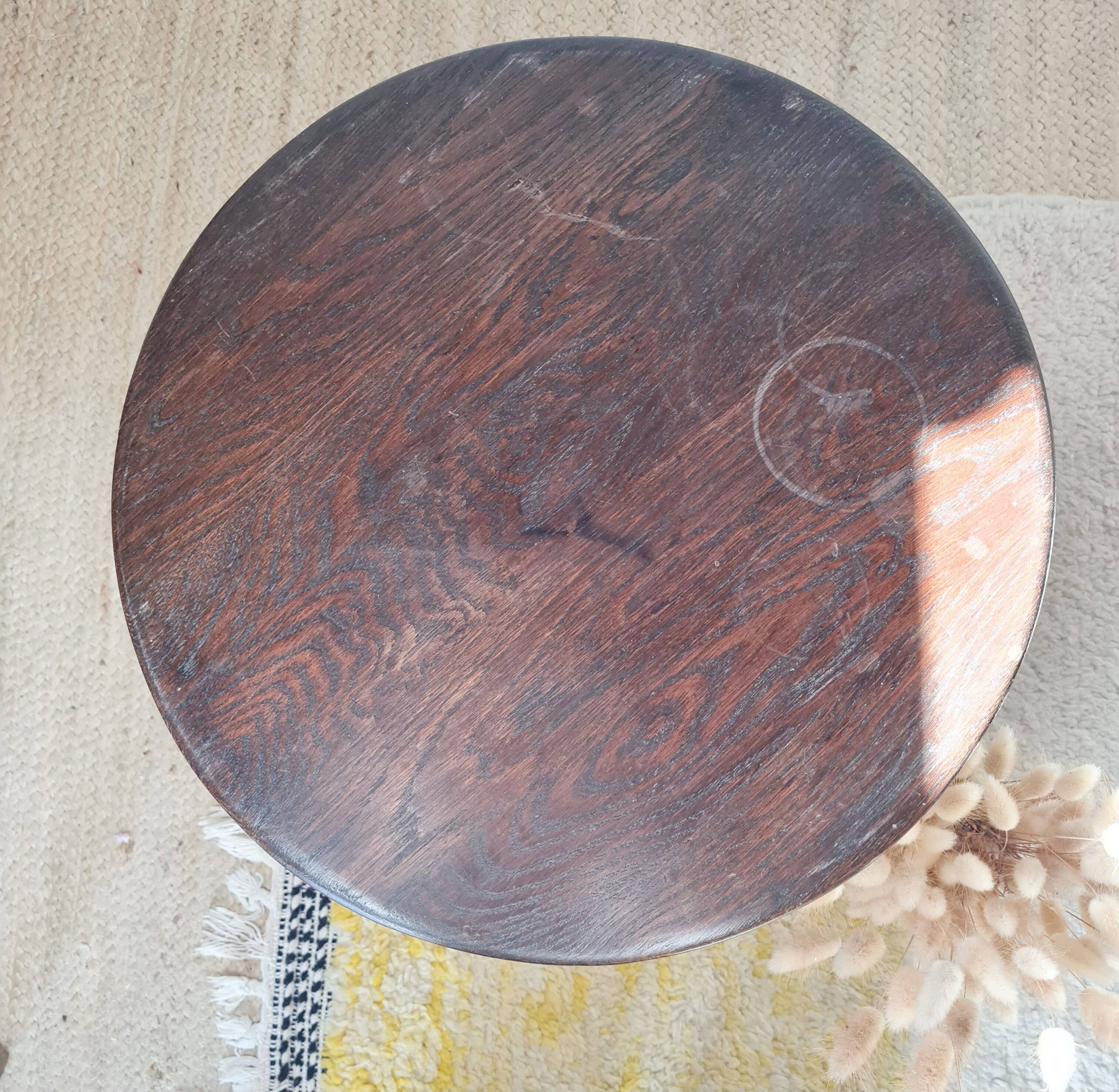 Vintage solid wood side table with curved legs.