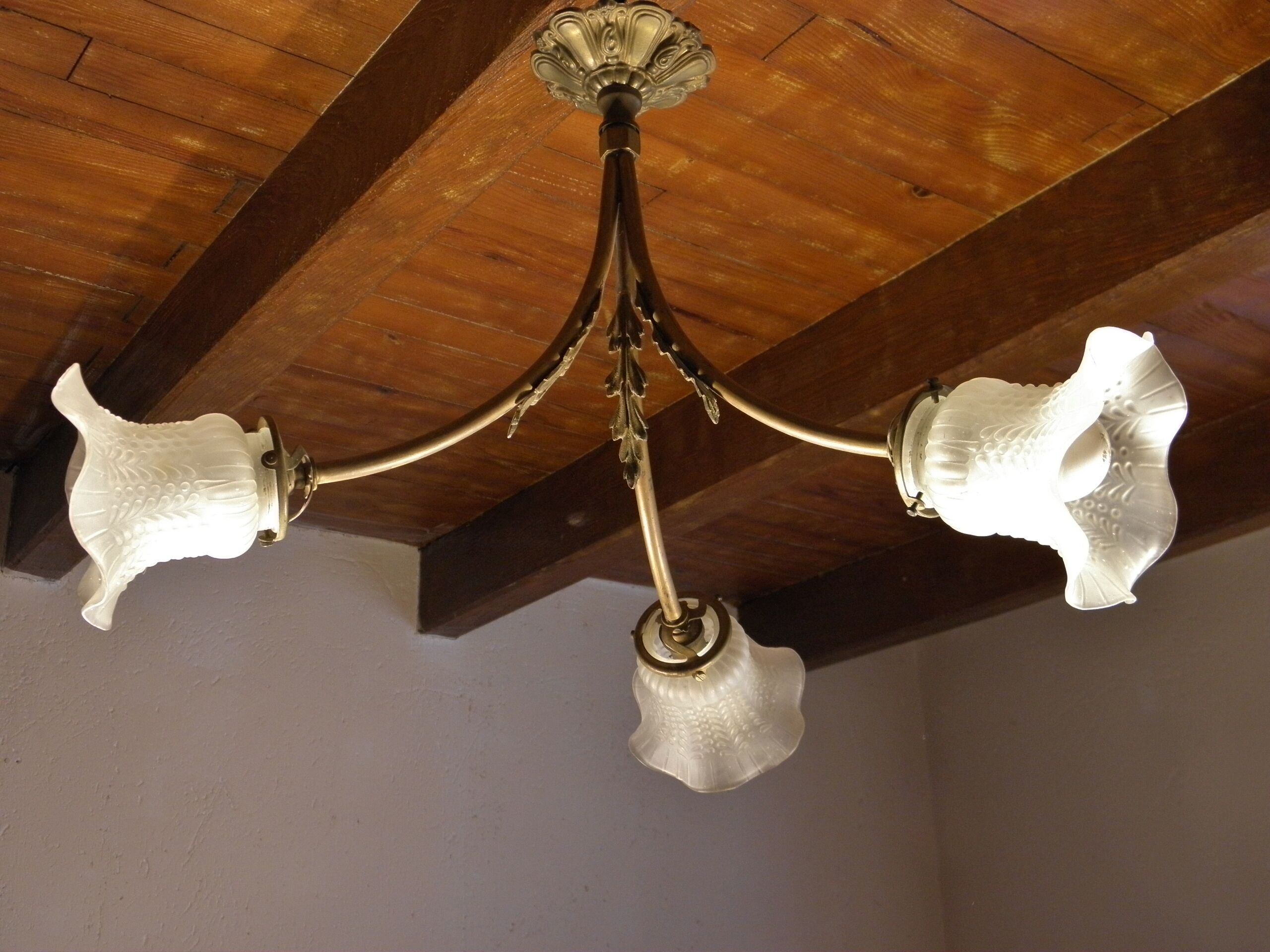 Three-spoke brass and glass chandelier