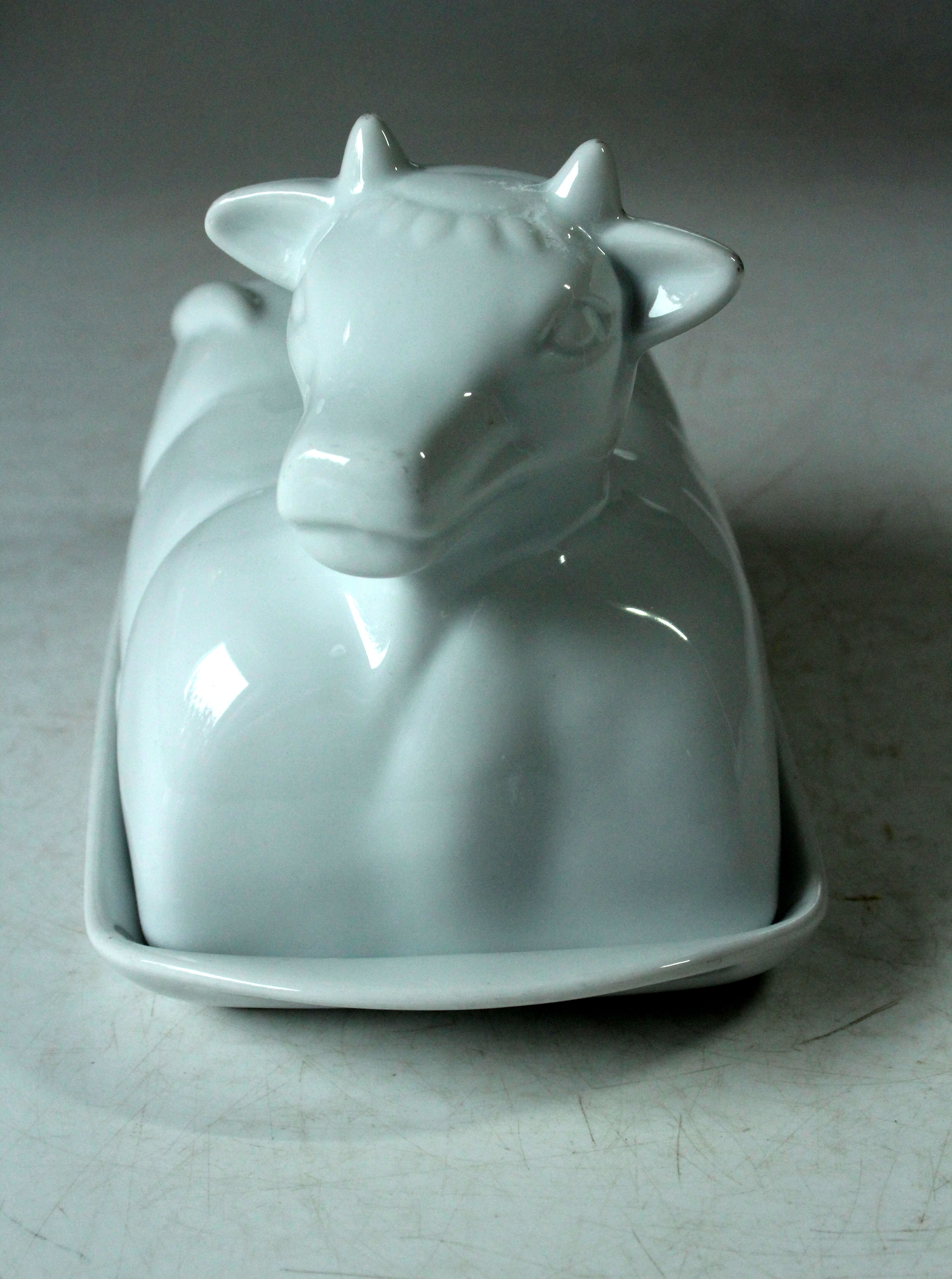 White ceramic butter dish in the shape of a cow, vintage