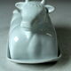 White ceramic butter dish in the shape of a cow, vintage