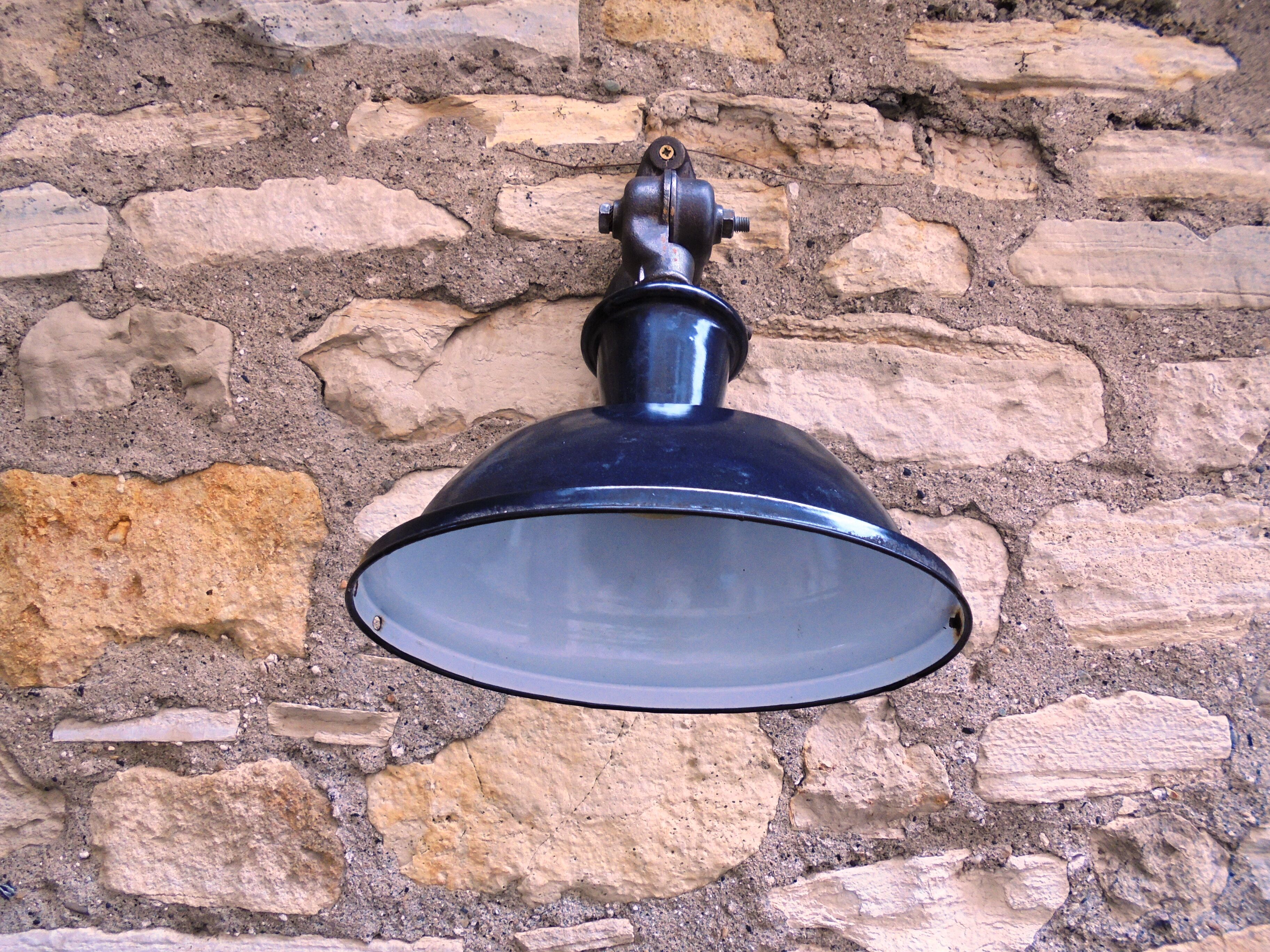 Antique cast iron and enamel wall lamp from the 1930s