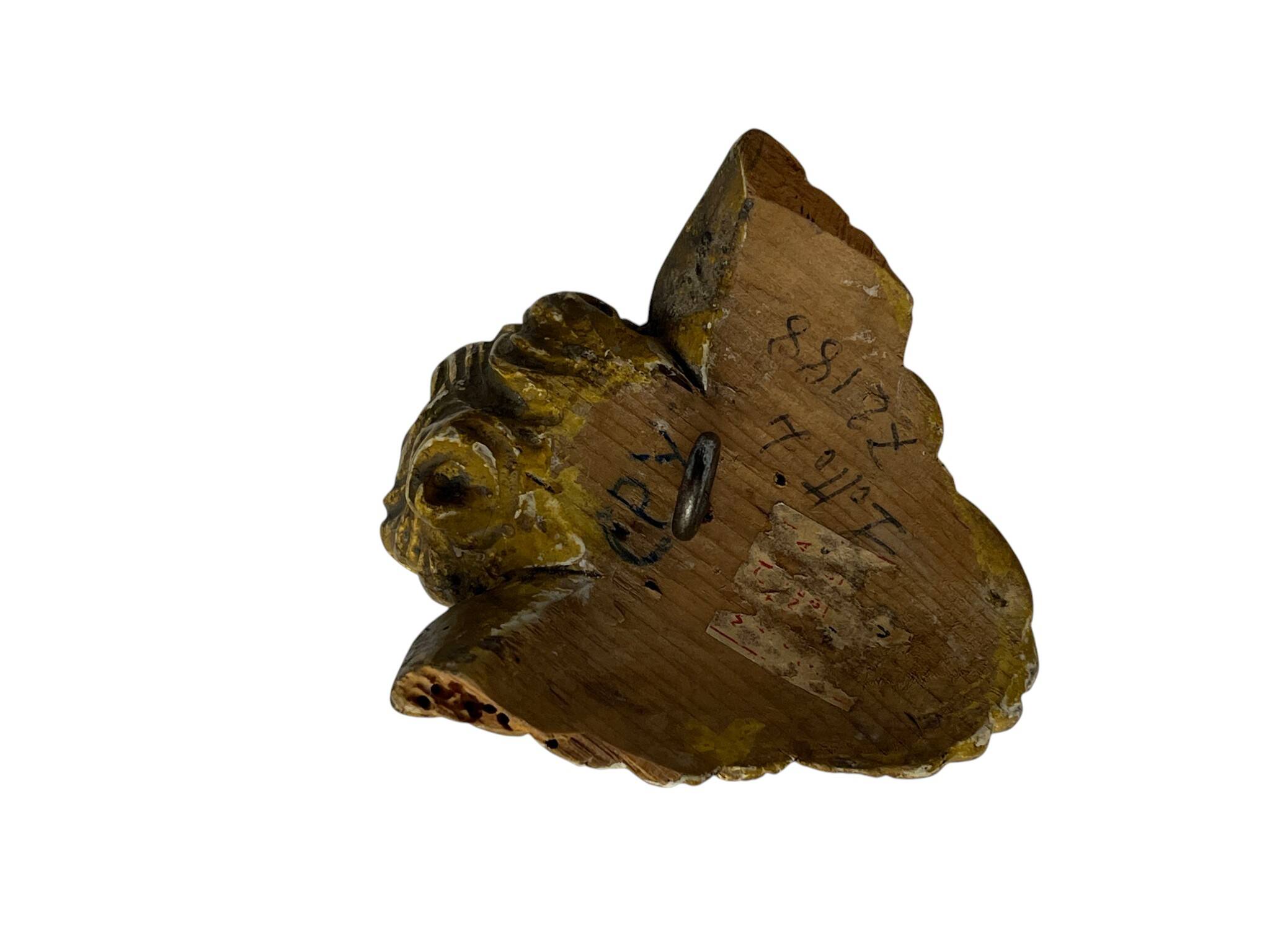 Antique cherub head in gilded wood from the early 20th century.