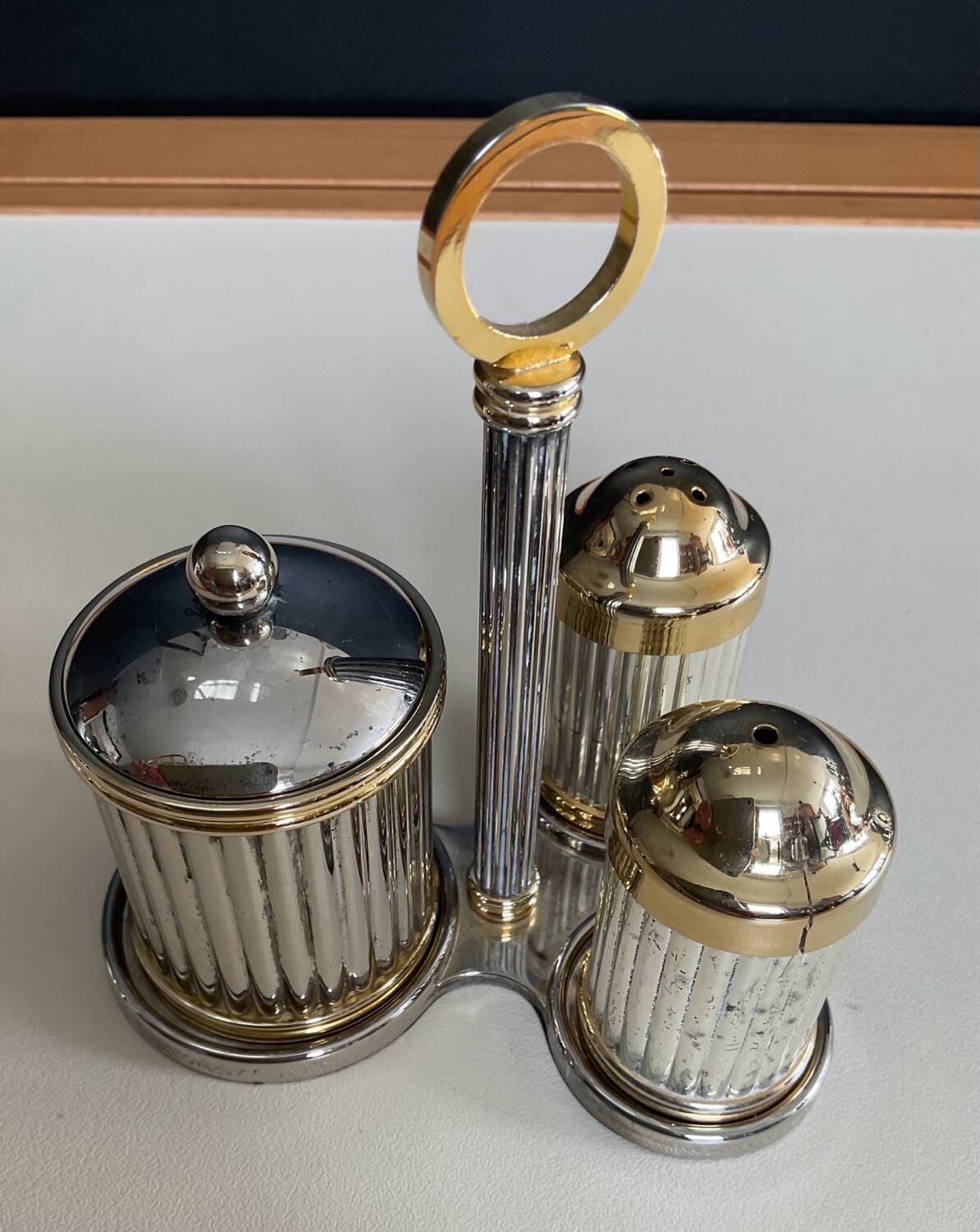 Vintage metal silver-plated and brass salt and pepper set.
