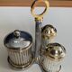 Vintage metal silver-plated and brass salt and pepper set.