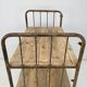 Vintage industrial iron and wood shelves on wheels