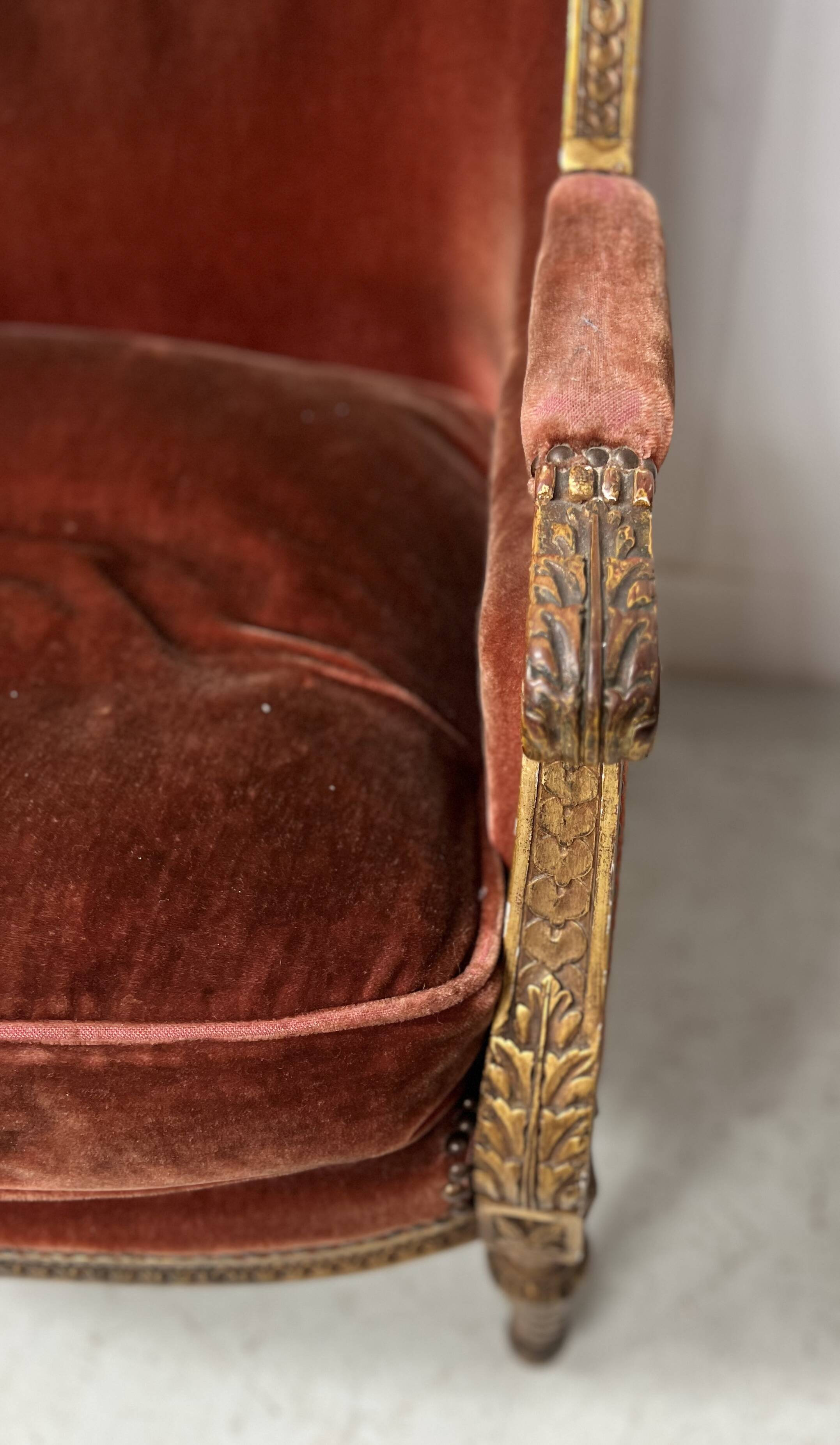 Two Louis XVI style wing chairs in gilded wood, 20th century