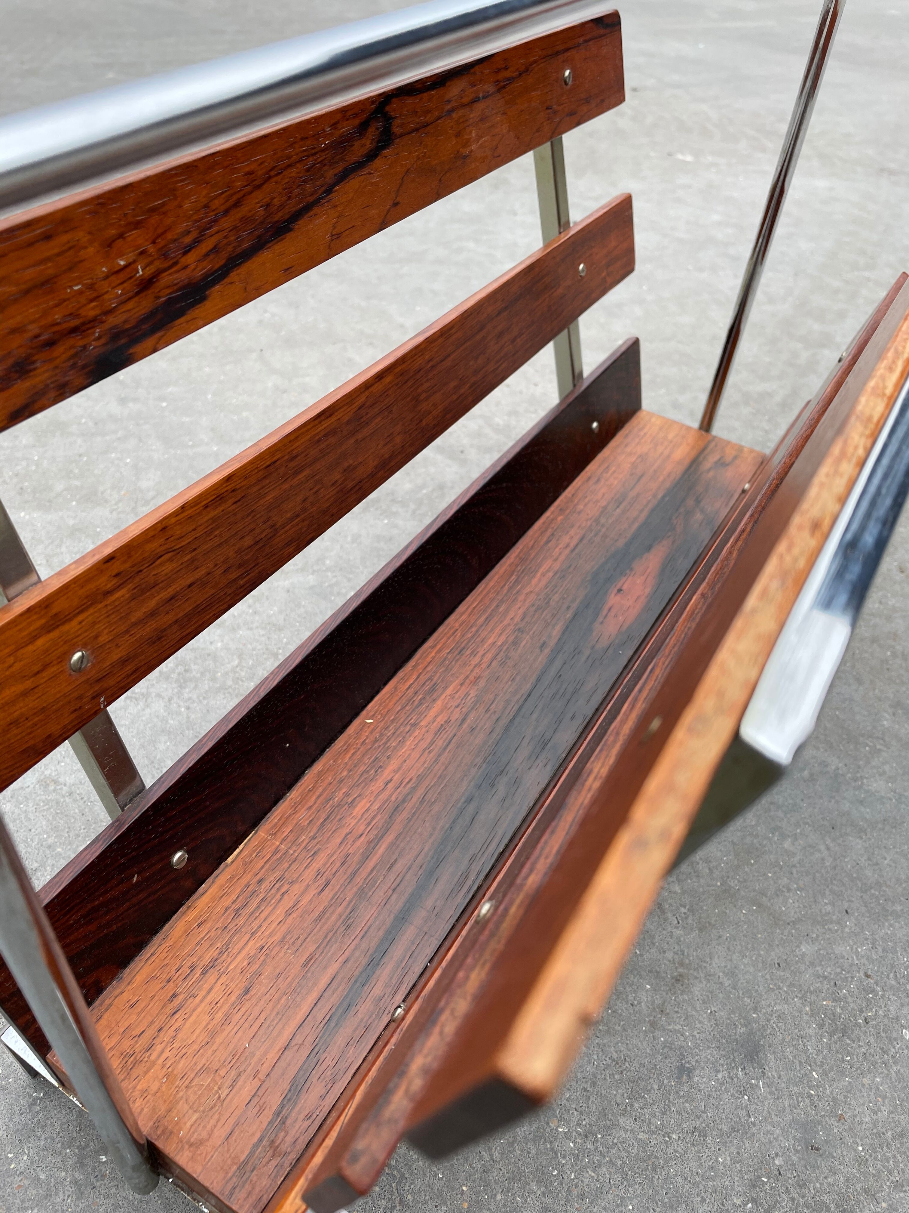Vintage magazine rack from  rosewood and chrome design