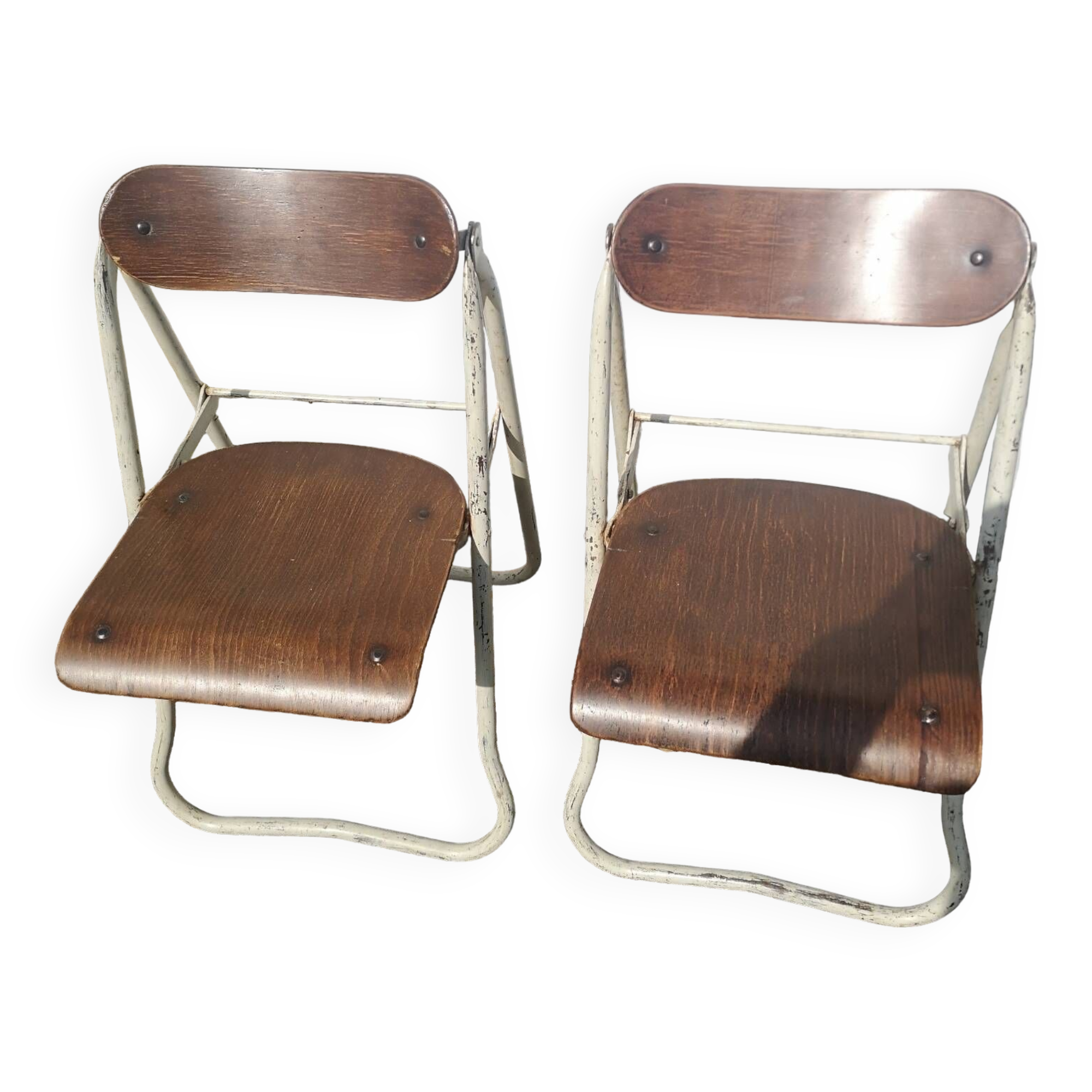 Pair of Bienaise model folding chairs from the Nelson brothers dating from the 1930s.
