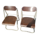 Pair of Bienaise model folding chairs from the Nelson brothers dating from the 1930s.