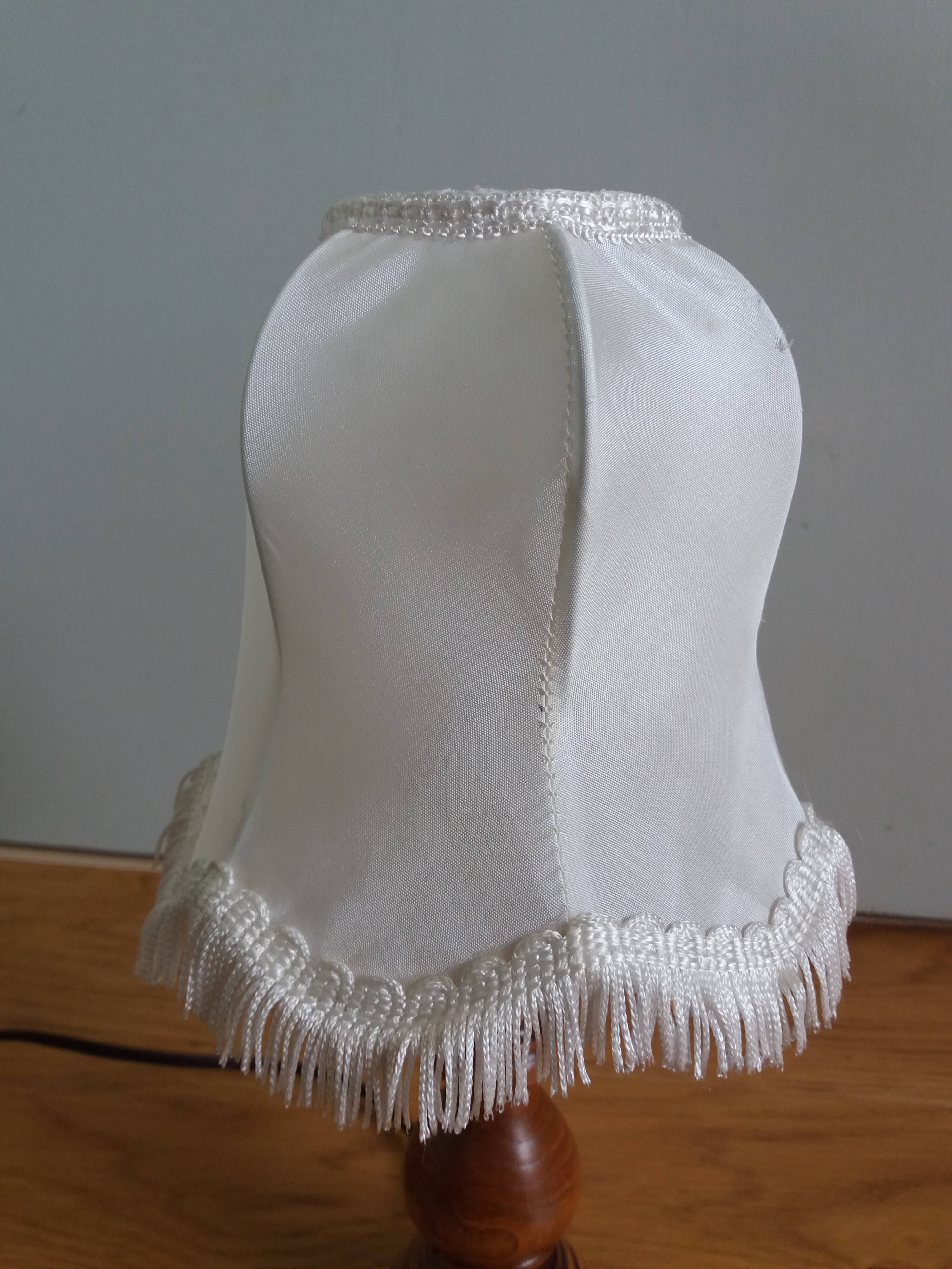 Turned wood lamp with fabric lampshade