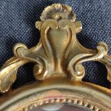 Antique hand-facing mirror in bronze and beveled glass