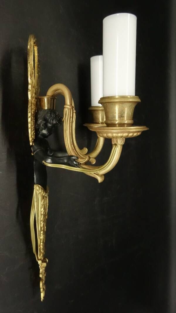 Pair of winged putti wall sconces in Louis XVI style - gilded bronze and black patina