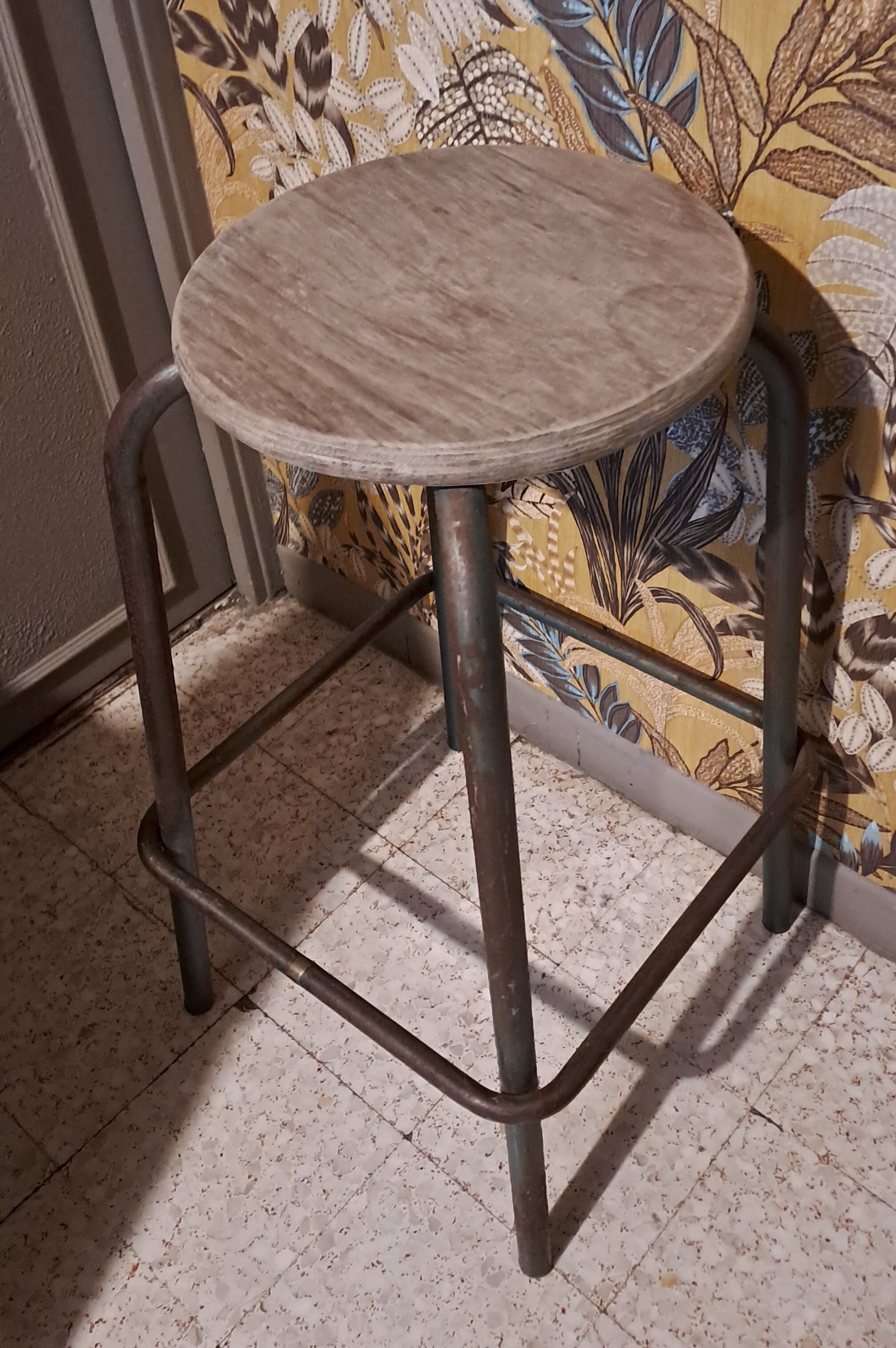 High metal stool and wooden seat Labo style dating from the 1940s industrial style