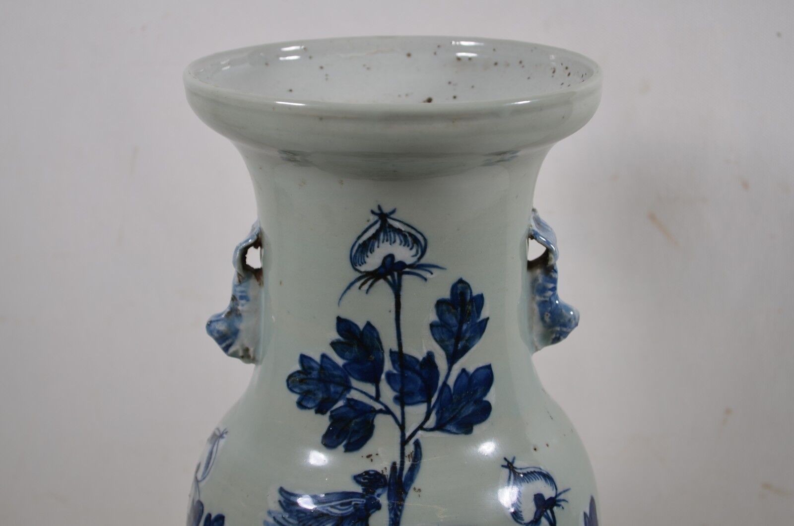 China. Porcelain mallet vase with blue and white phoenix decoration on a rock.