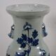 China. Porcelain mallet vase with blue and white phoenix decoration on a rock.