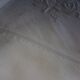 Antique embroidered linen sheet with a monogram.