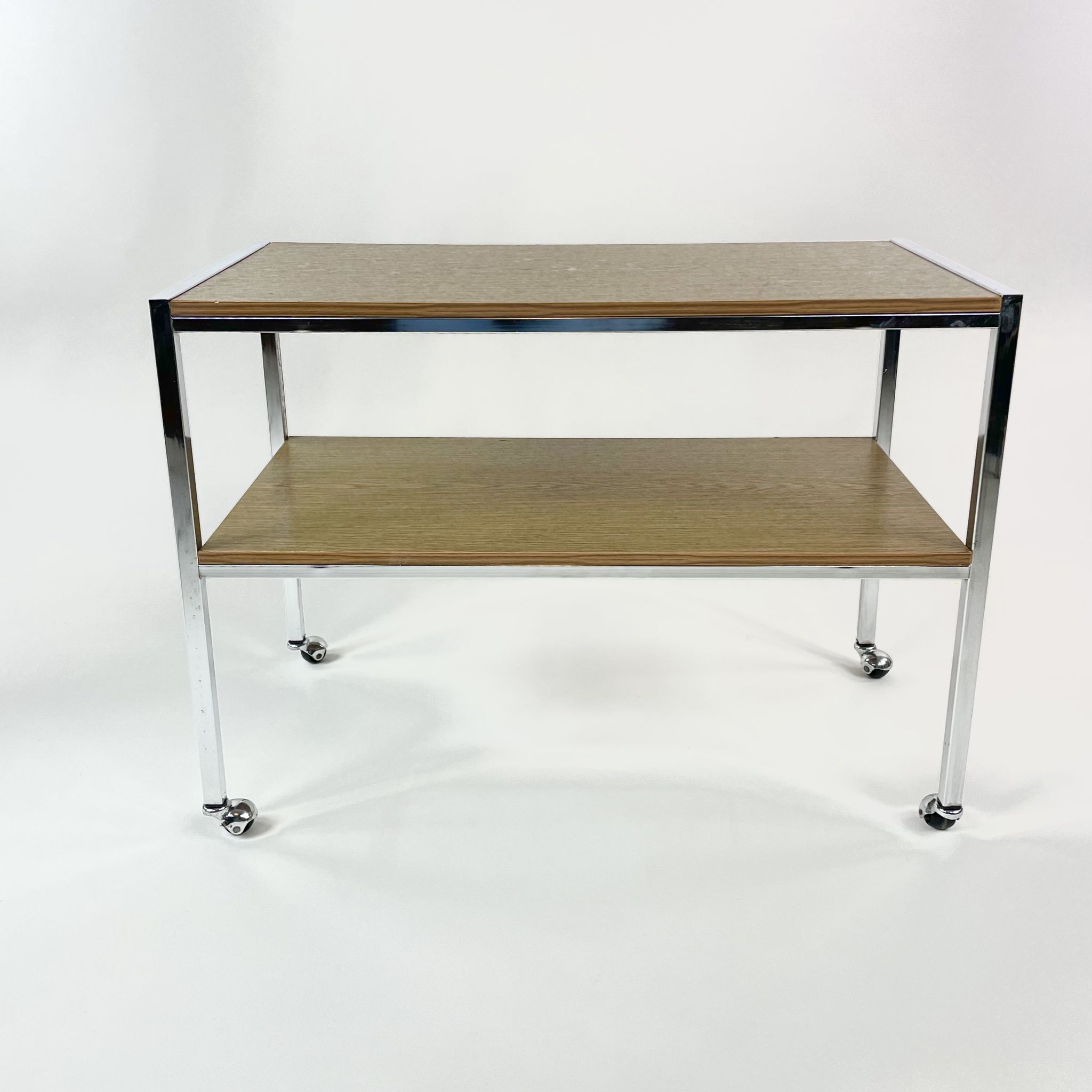 Table on wheels, laminate top and metal Eiffel legs, circa 1950