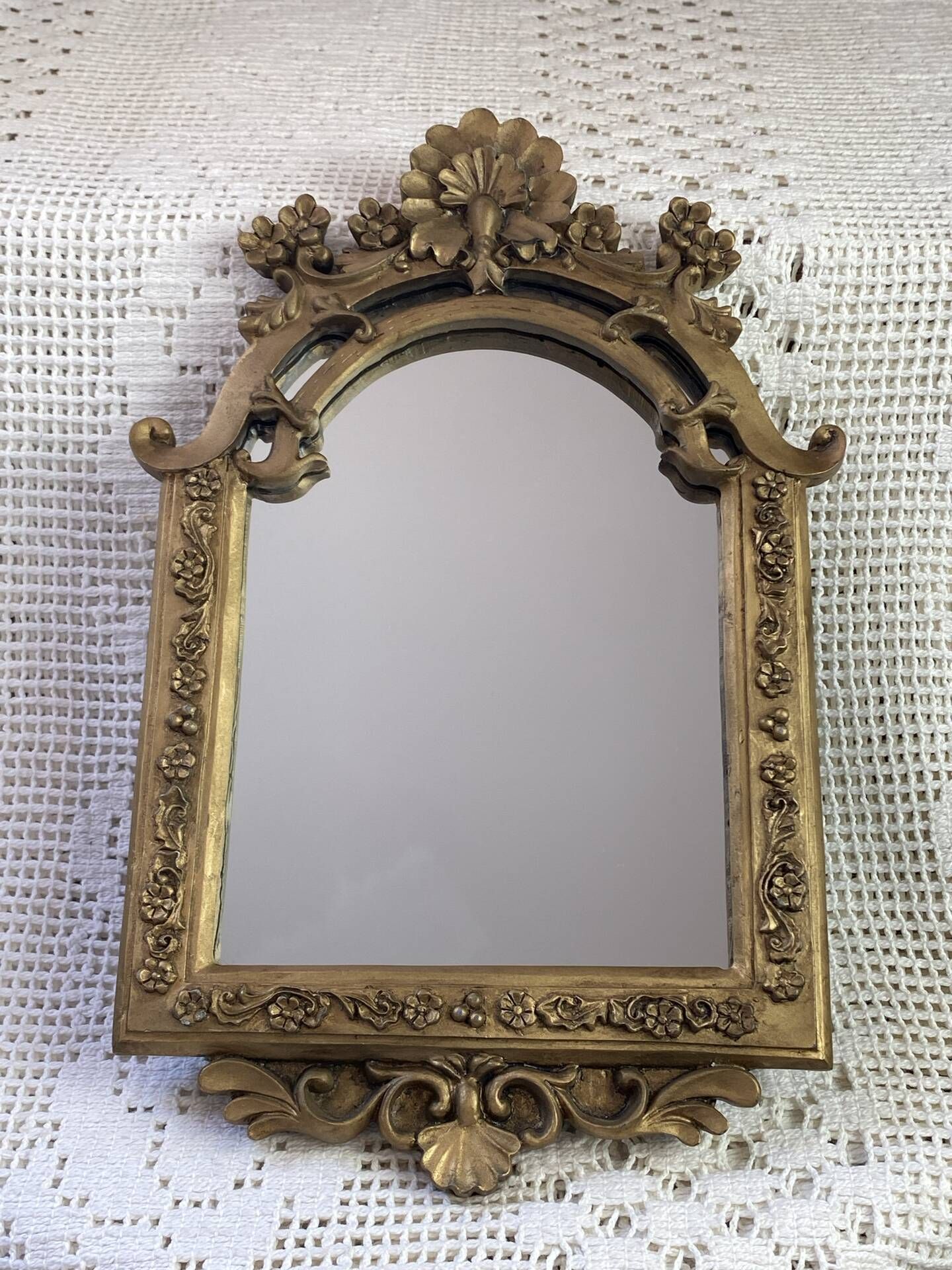 Baroque style mirror, decorated with shells and flowers.