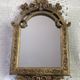 Baroque style mirror, decorated with shells and flowers.