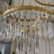Empire style pagoda chandelier in gilded bronze with crystal pendants