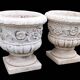 Pair of Medici planters with floral decoration