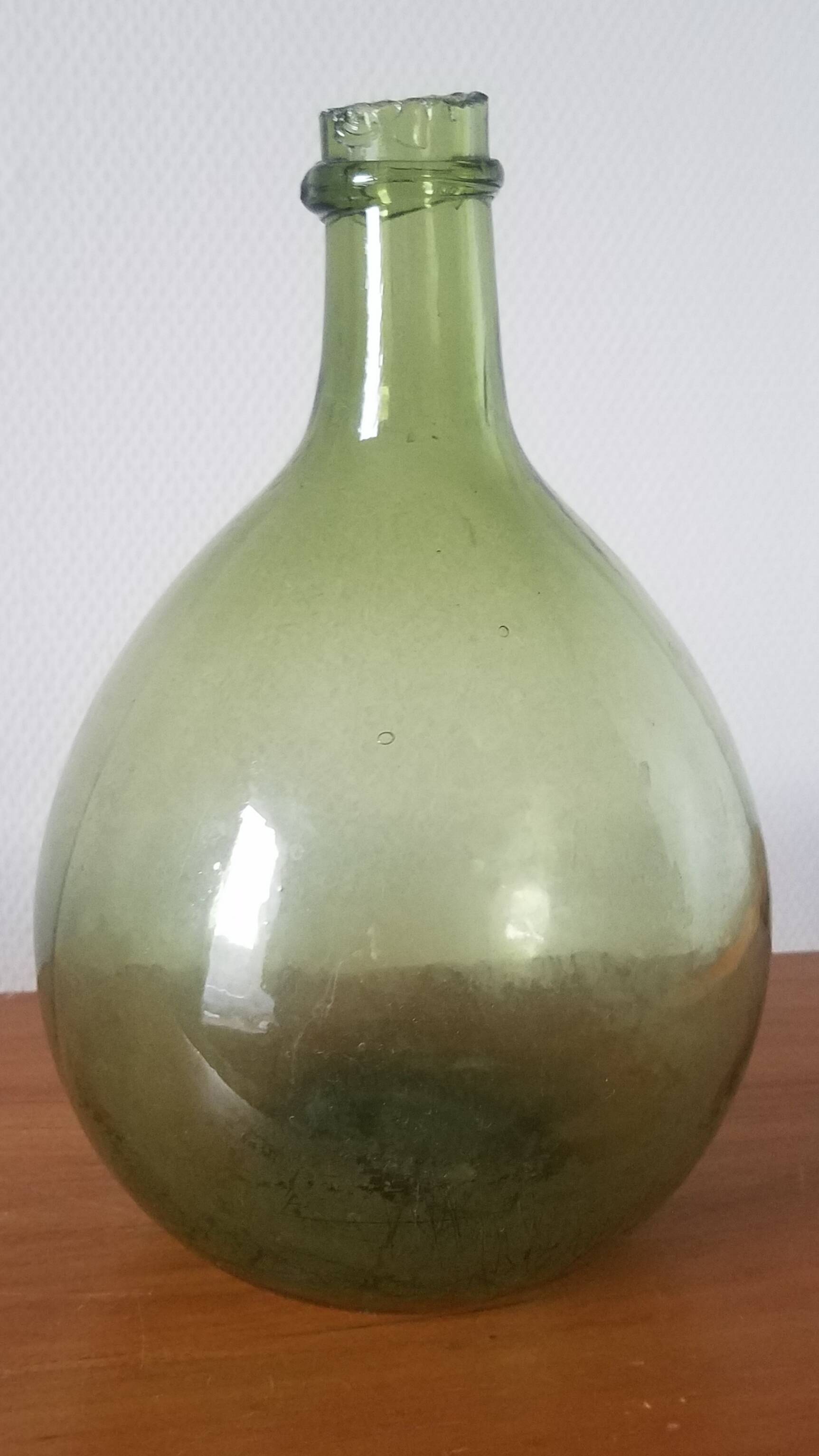 Vintage green demijohn