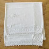 Old bolster case with lace edge and embroidered.