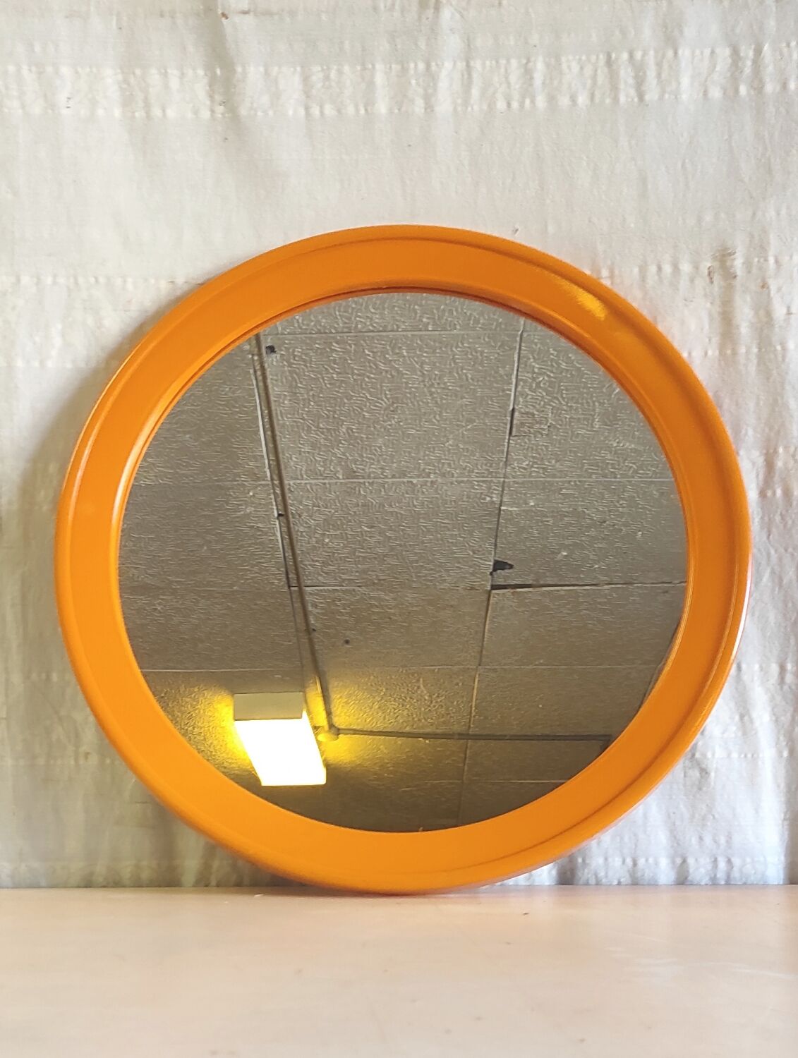 Round orange plastic mirror - 1970s