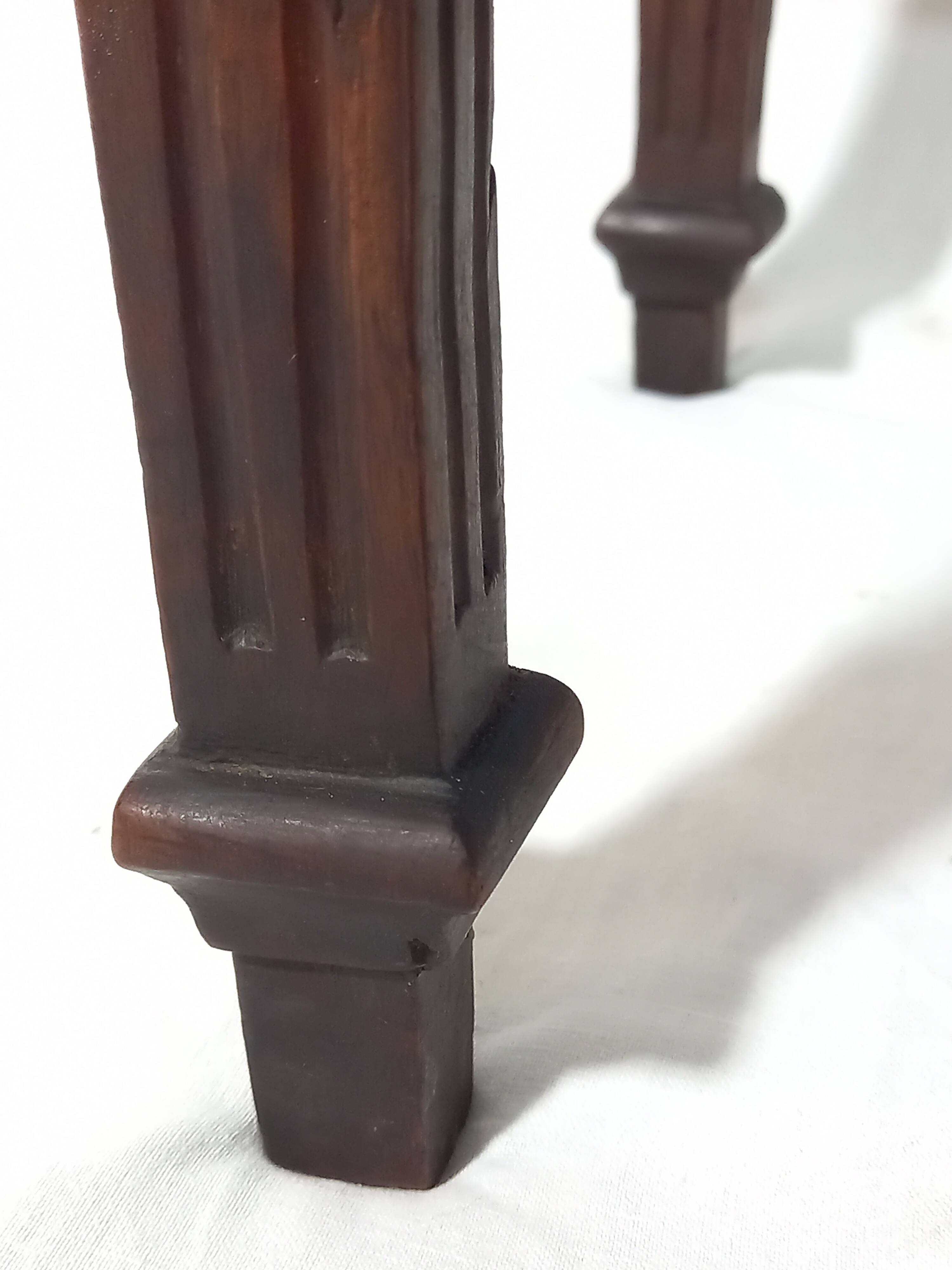 Small old side table with brass finishes