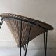 Italian basket chair in rattan and black metal, 1950s design.