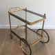 Neoclassical brass rolling table from Maison Baguès