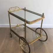 Neoclassical brass rolling table from Maison Baguès